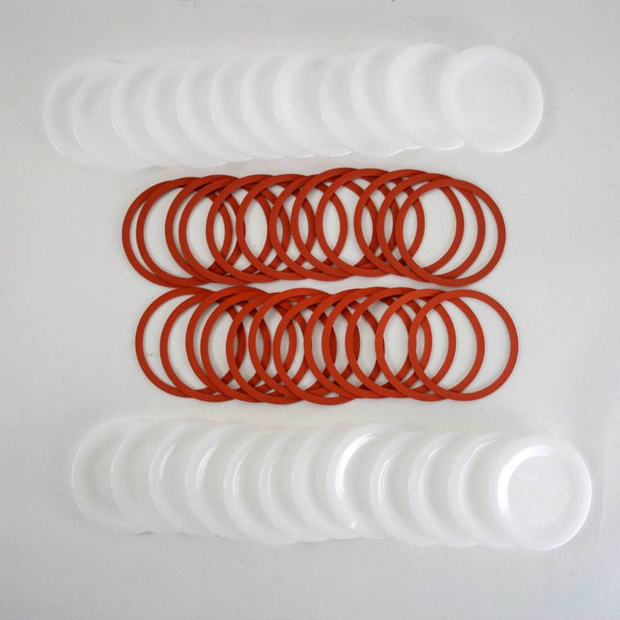 Set of reusable regular-sized canning jar lids and red sealing rings, handcrafted and made in USA, ideal for Kitchen & Food, Food Preservation, and Canning collections.