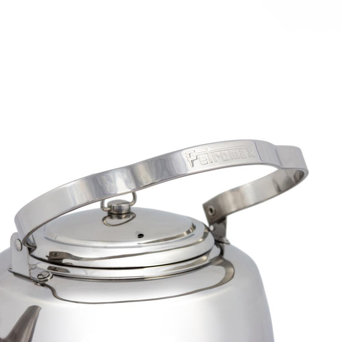 Close-up of the bent stainless steel handle with embossed logo on a polished teakettle lid, designed for comfortable hanging and use in Farm, Garden & Tool, Camping, and Brewing Coffee and Tea collections.