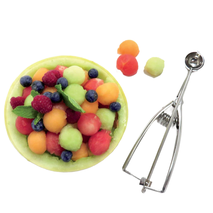 Metal scoop with a spring release mechanism alongside colorful melon balls and fresh berries in a melon bowl, perfect for Kitchen & Food, Cookware, Baking Supplies, and Kitchen Gadgets collections.