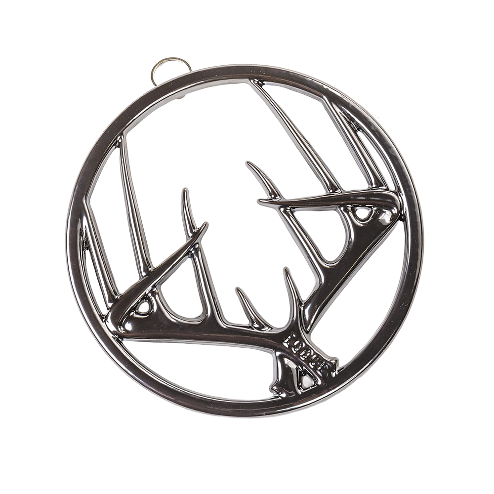 Round enamel trivet featuring an antler design with a glossy finish, built-in hanger, and rubber feet, suitable for Kitchen & Food, Dinnerware, Storage and Serving, Best Sellers, and Promo Eligible collections.