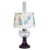 Vintage-style oil lamp with a clear glass bowl over an amethyst pedestal base, featuring a decorative peacock-patterned shade, part of Lamps & Lighting and Best Sellers collections.