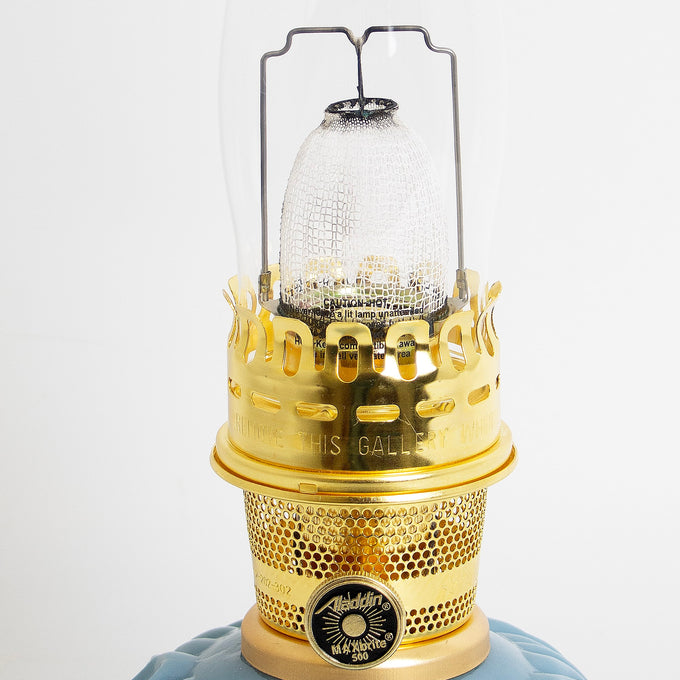 Close-up of a handcrafted limited edition oil lamp burner with polished brass elements and clear textured chimney, featured in Lamps & Lighting, Oil Lamps, Table Lamps, Best Sellers, and Promo Eligible collections.
