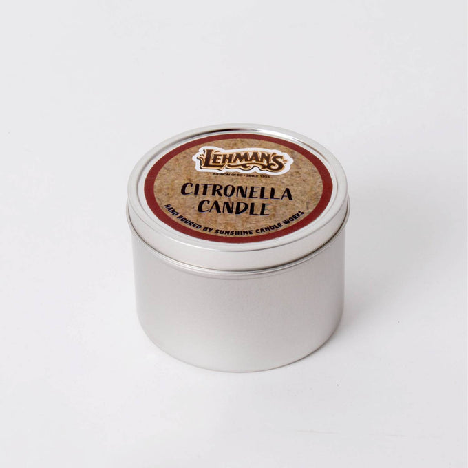 Compact handcrafted citronella candle in a lightweight silver metal tin with branded label, designed for outdoor use in camping, pest control, and garden lighting collections.