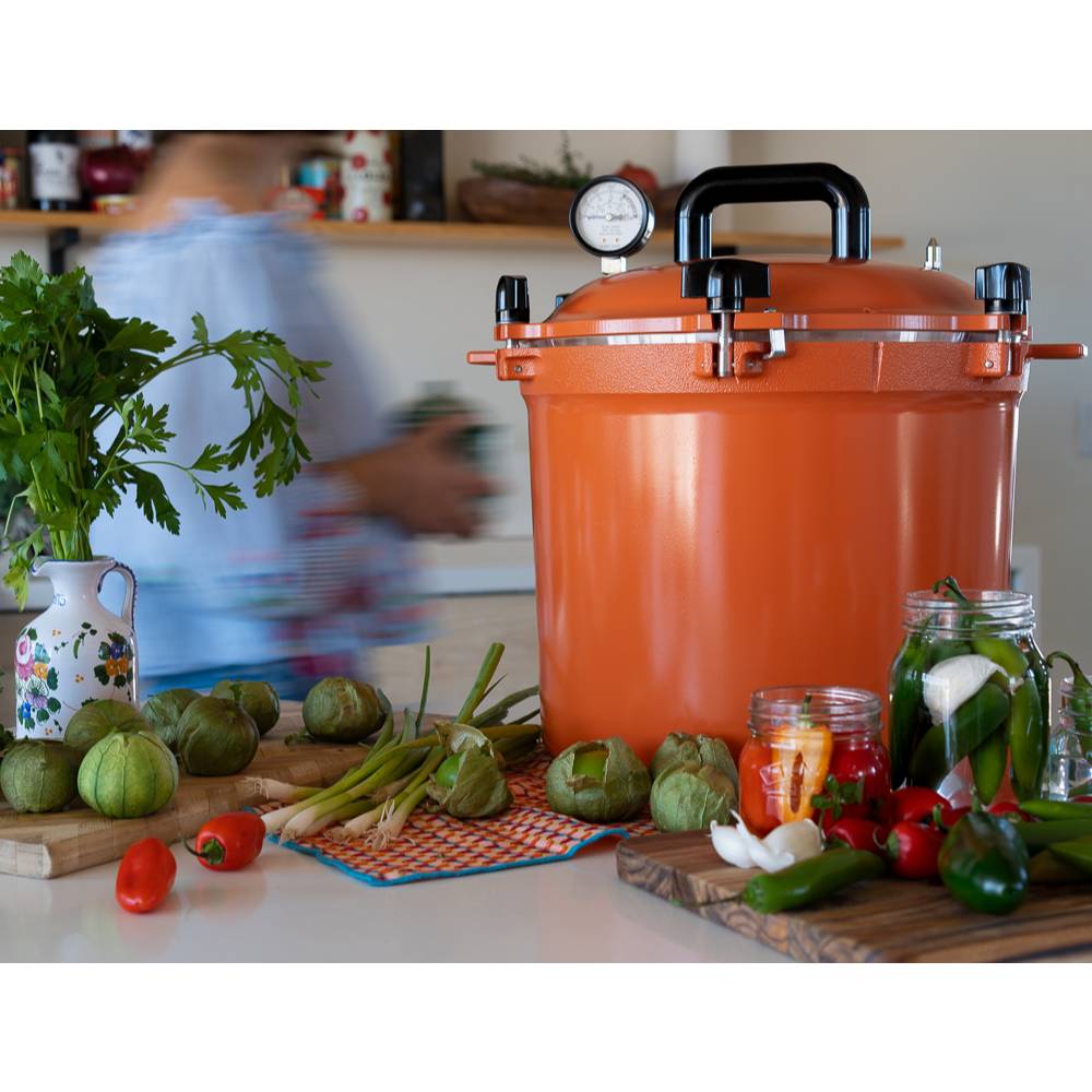 Bright orange 21.5-quart handcrafted pressure canner with secure locking lid and pressure gauge, ideal for Kitchen & Food, Food Preservation, Canning, Pressure Canners, and USA Made collections.