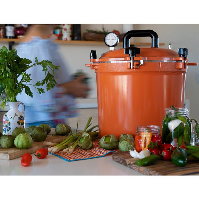 Bright orange 21.5-quart handcrafted pressure canner with secure locking lid and pressure gauge, ideal for Kitchen & Food, Food Preservation, Canning, Pressure Canners, and USA Made collections.