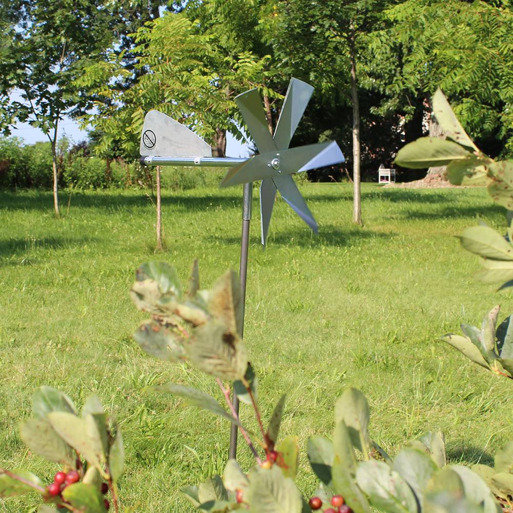 Handcrafted Amish-made mole chaser with polished metal blades and tail vane on a slender post, designed for humane pest control in Farm, Garden & Tool, Garden Accessories, Lawncare, Pest Control, Best Sellers, and Promo Eligible collections.