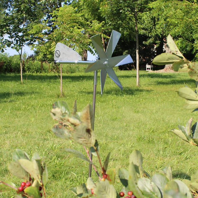 Handcrafted Amish-made mole chaser with polished metal blades and tail vane on a slender post, designed for humane pest control in Farm, Garden & Tool, Garden Accessories, Lawncare, Pest Control, Best Sellers, and Promo Eligible collections.