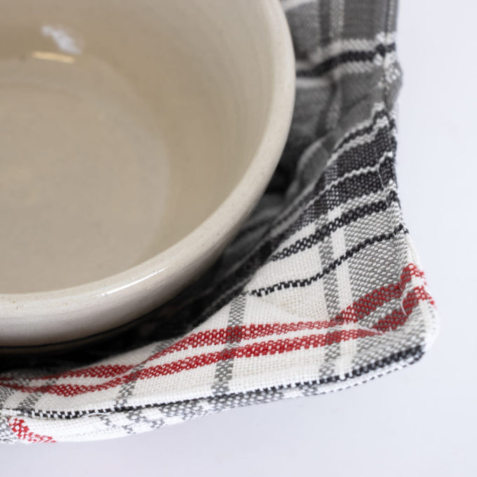 Handcrafted plaid bowl cozy in white, black, and red cotton, designed to protect hands and surfaces from hot dishes, featured in Kitchen & Food, Kitchen Textiles, Storage and Serving, Best Sellers, and Promo Eligible collections.
