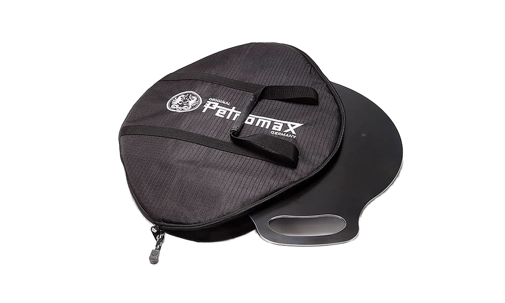 Black durable transport bag partially open, revealing a sturdy metal griddle with integrated handles, designed for secure carrying in Farm, Garden & Tool and Camping collections.