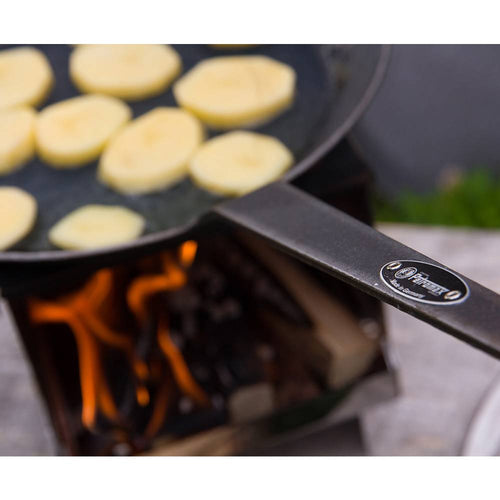Handcrafted wrought iron pan with a long handle cooking sliced potatoes over an outdoor flame, perfect for Farm, Garden & Tool, Kitchen & Food, Camping, and Cookware collections.
