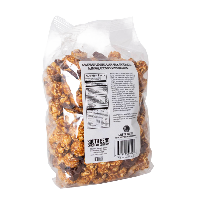 Clear plastic bag of handcrafted caramel popcorn mixed with almonds, cherries, and cinnamon, labeled with nutritional information, featured in Kitchen & Food, Snacks and Sweets, Popcorn, and Best Sellers collections.