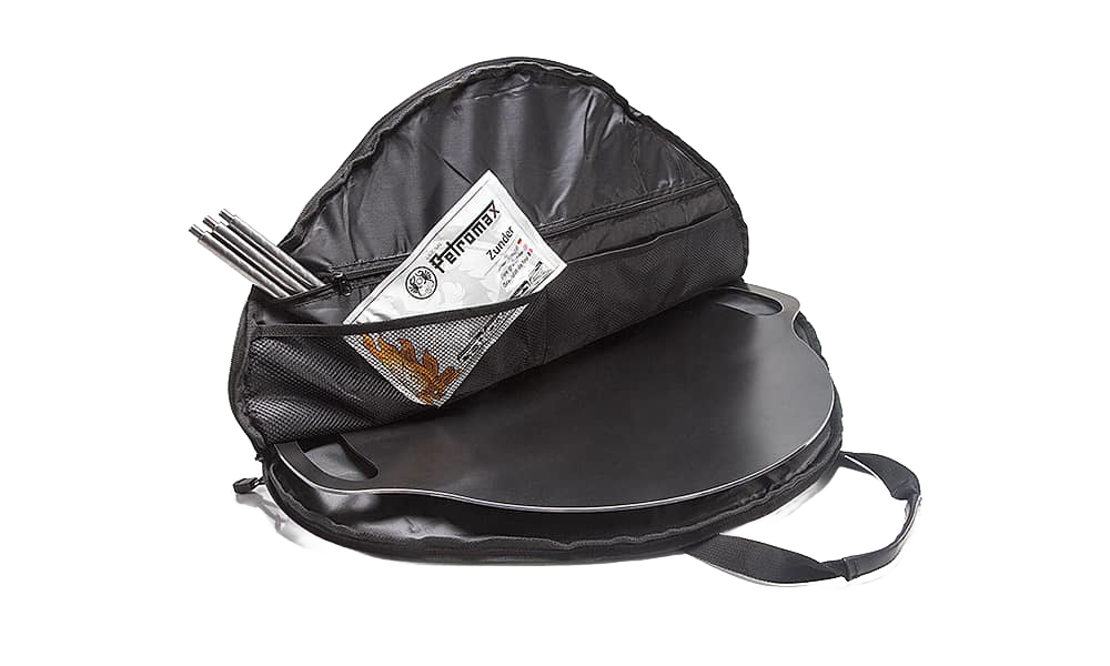 Black round transport bag with spacious interior, mesh pocket, and durable handles, designed for secure packing of griddles and fire bowls, perfect for camping, farm, and garden use.