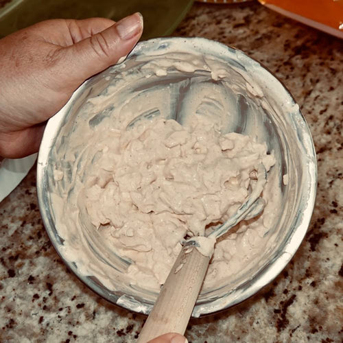 Handcrafted Amish made dough whisk with a smooth wooden handle and two spiral wires stirring thick dough in a metal bowl, part of Kitchen & Food and Baking Supplies collections.