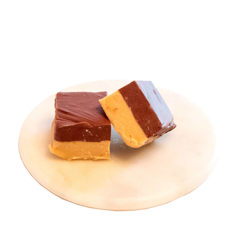 Two handcrafted two-layer squares of creamy peanut butter and rich chocolate fudge with a smooth, melt-in-your-mouth texture, featured in Kitchen & Food, Snacks and Sweets, USA Made, Best Sellers, and Promo Eligible collections.