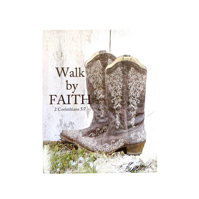Handcrafted 5"x7" plaque featuring rustic brown embroidered cowboy boots against weathered white wood with the Bible verse “Walk by Faith” from 2 Corinthians, ideal for Home & Decor, Best Sellers, and Promo Eligible collections.