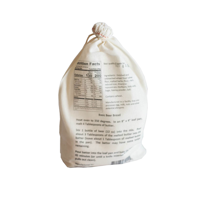 Natural cotton drawstring bag containing handcrafted Basic Beer Bread mix with baking instructions and nutrition facts, perfect for Kitchen & Food, Pantry, Dry Goods and Mixes, Best Sellers, and Promo Eligible collections.