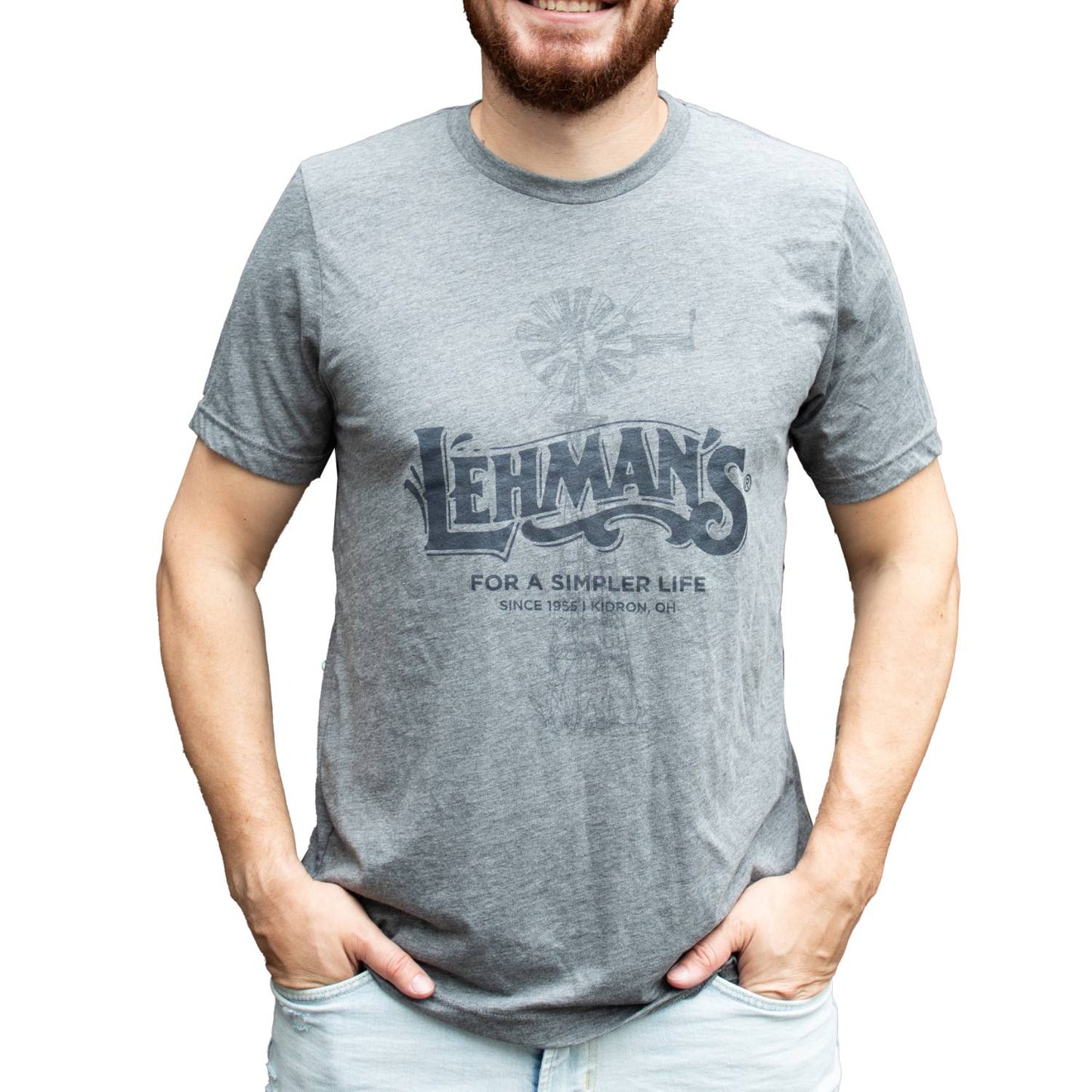 Man wearing a soft, lightweight heather gray tee with a faded windmill graphic and vintage Lehman's "For a Simpler Life" print, perfect for Health & Wellness and Best Sellers collections, handcrafted quality.
