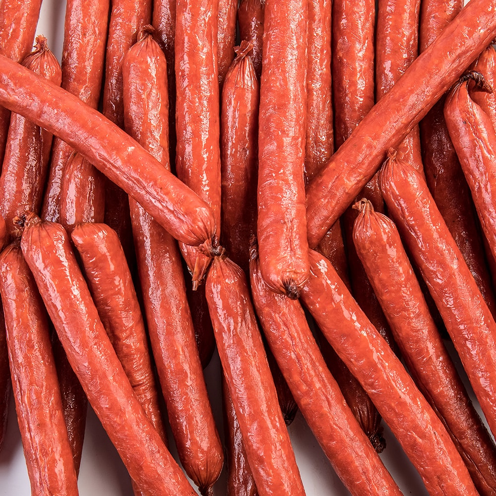 Close-up of handcrafted hickory smoked snack sticks made with pork and beef, a savory protein-rich treat perfect for Kitchen & Food, Snacks and Sweets, Meats, USA Made, Best Sellers, and Promo Eligible collections.