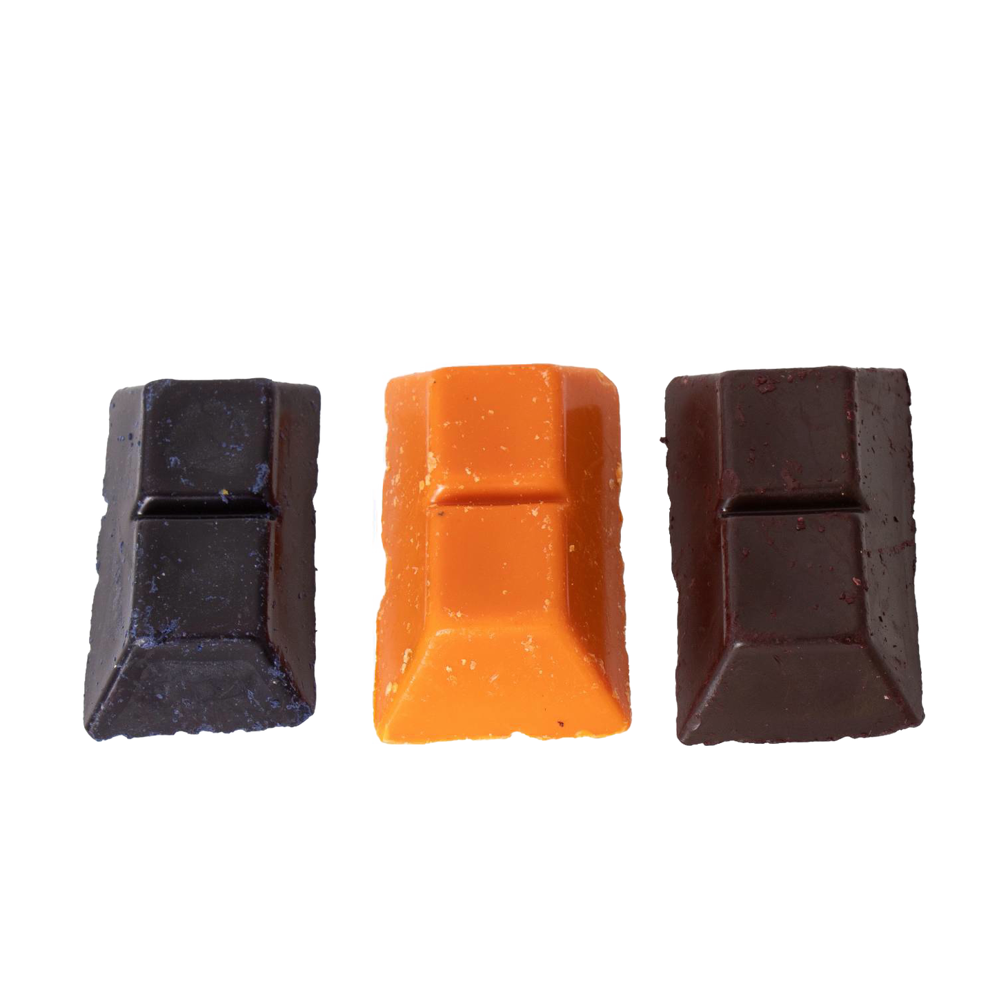 Three handcrafted candle dye chips in dark blue, orange, and brown colors, designed for use in lamps & lighting, candlemaking supplies, and best sellers collections.