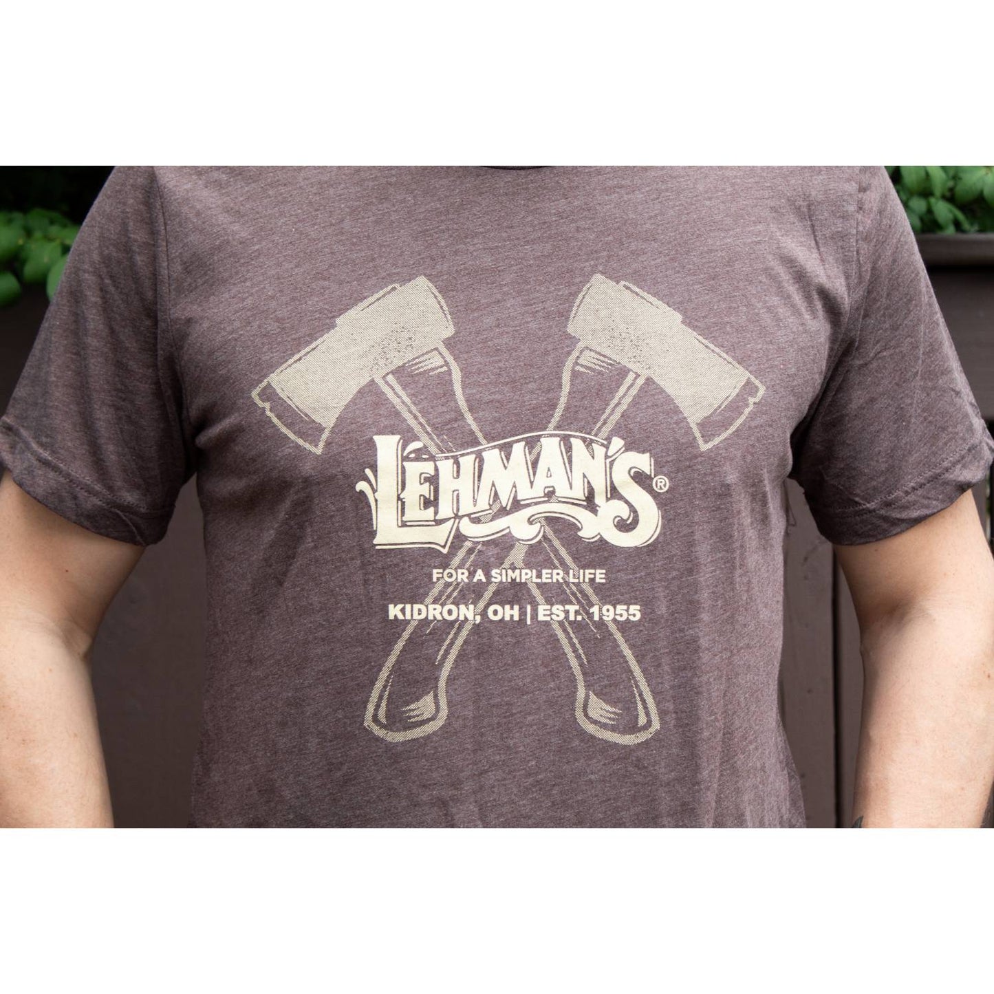 Brown lightweight comfy t-shirt with cream graphic of two crossed axes and Lehman's logo, inspired by unique Amish craftsmanship, ideal for Health & Wellness and Clothing collections.