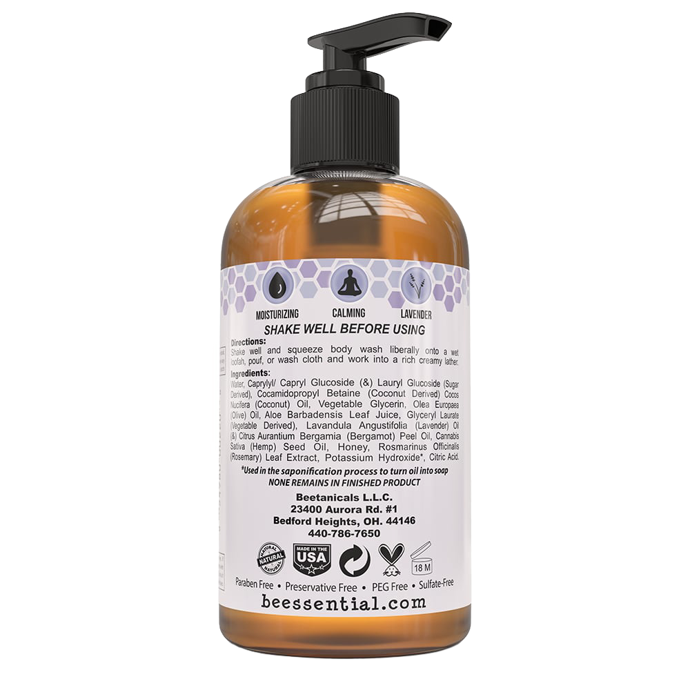 Back view of Beessential Natural Body Wash 8 oz amber pump bottle displaying detailed ingredients list, usage instructions, and certification icons; handcrafted USA made product included in Health & Wellness, Soaps, and Best Sellers collections.