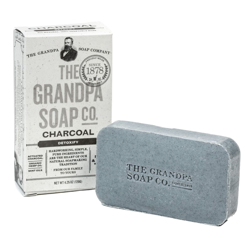 Handcrafted charcoal soap bar embossed with brand name next to vintage-style box packaging, featuring natural detoxifying ingredients, part of Health & Wellness, Soaps, Grooming, USA Made, Best Sellers, and Promo Eligible collections.