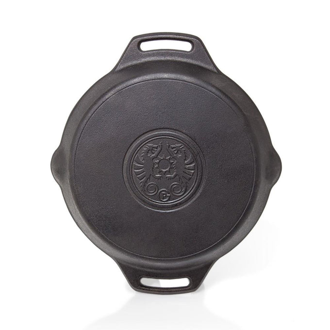 Top view of a sturdy cast iron fire skillet with two side handles and embossed center emblem, ideal for farm, garden, kitchen, camping, cookware, and cast iron collections.