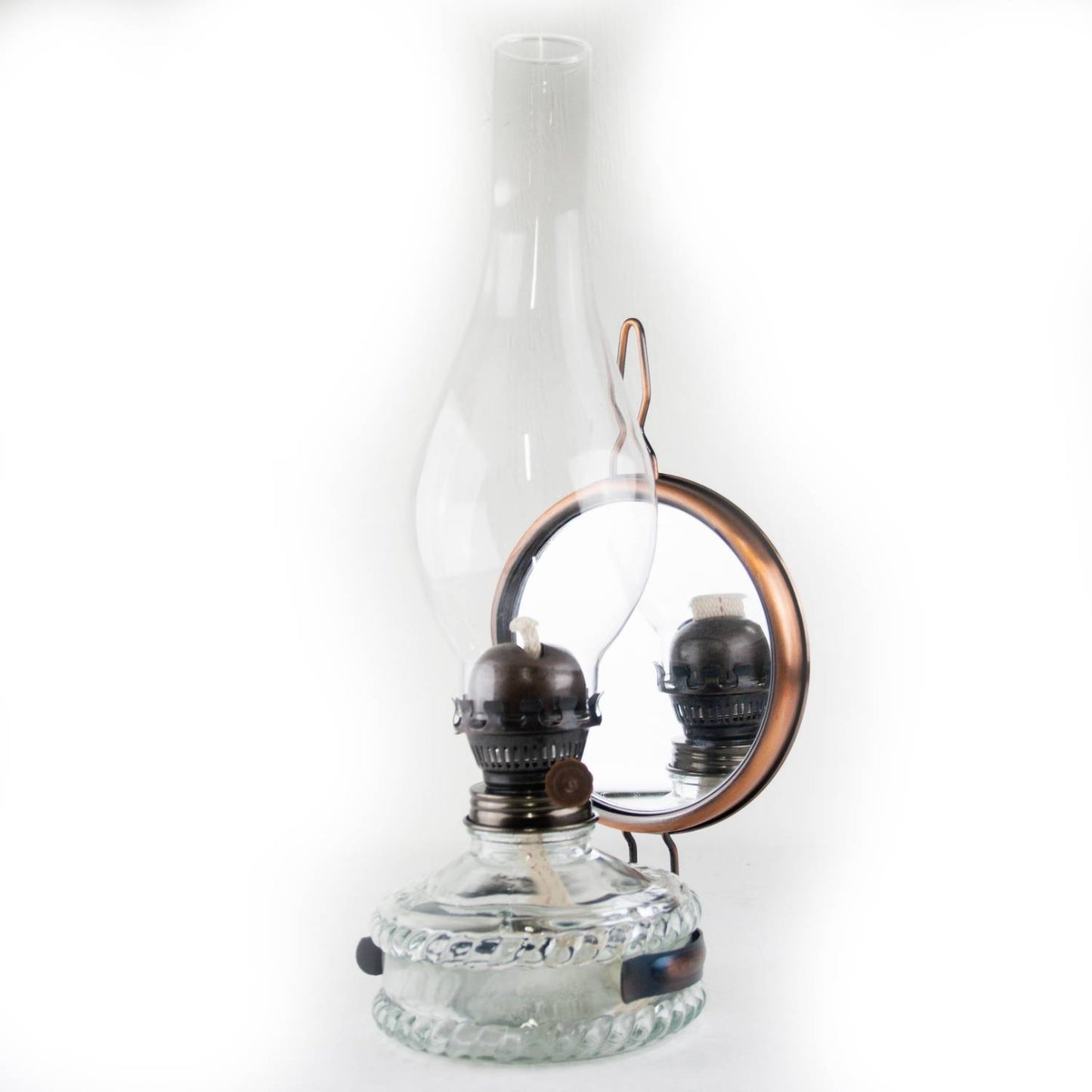 Handcrafted reflector oil lamp with a clear glass base, removable mirror reflector, and tall glass chimney, ideal for Lamps & Lighting, Oil Lamps, Wall Lamps, Best Sellers, and Promo Eligible collections.