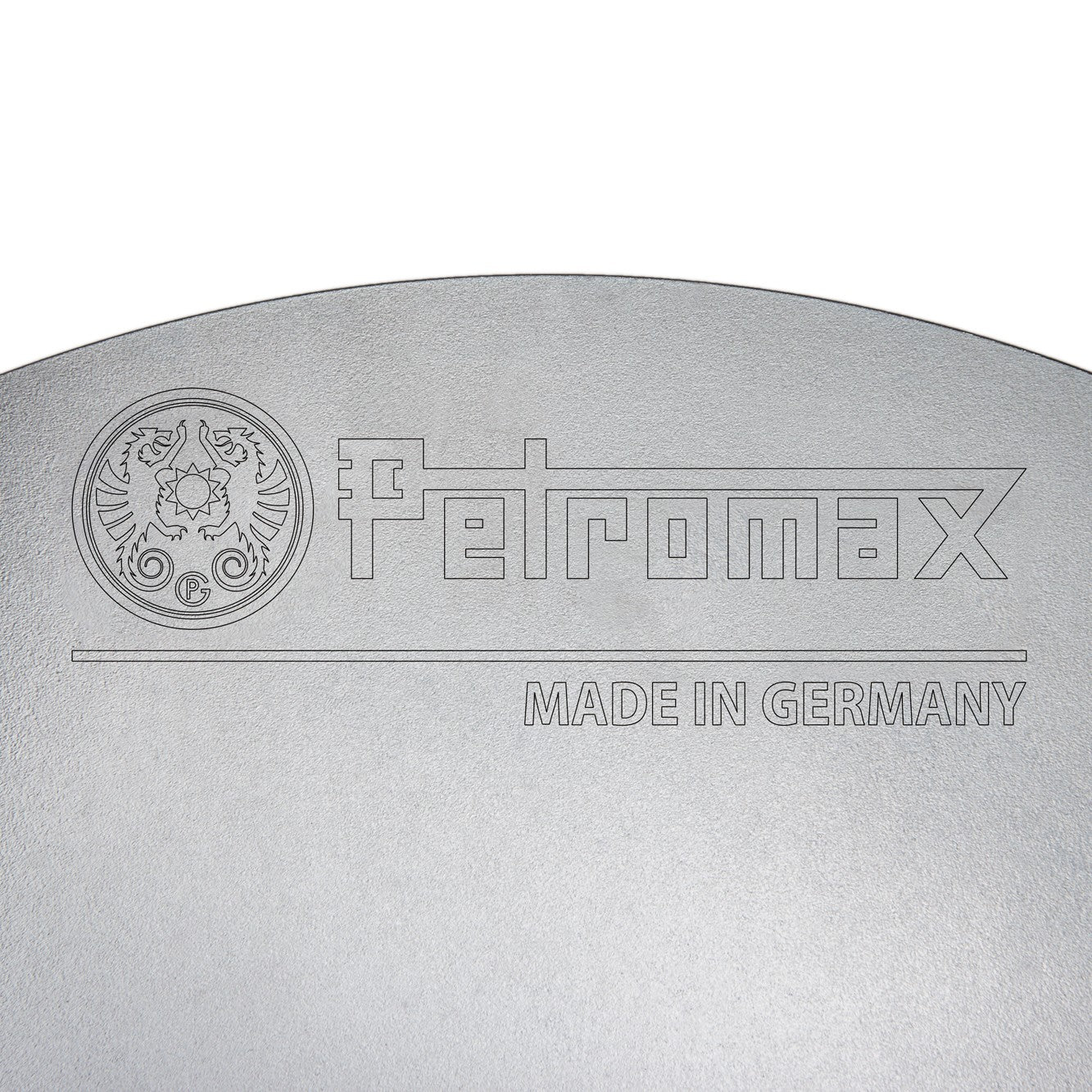 Close-up of a steel cooking surface engraved with the Petromax logo and "Made in Germany," showcasing quality craftsmanship for Farm, Garden & Tool, Camping, Best Sellers, Promo Eligible collections.
