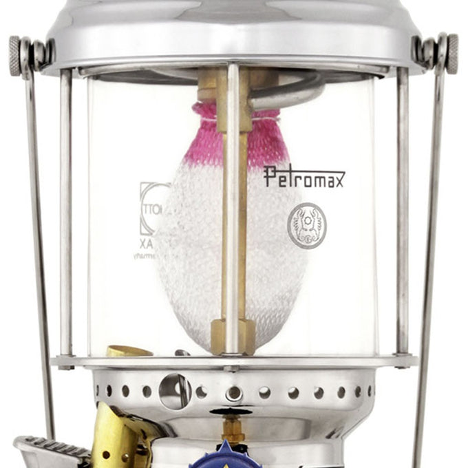 Close-up of a handcrafted kerosene pressure lamp showcasing a polished metal frame, clear glass globe, and woven mantle, ideal for farm, garden, camping, and emergency lighting.