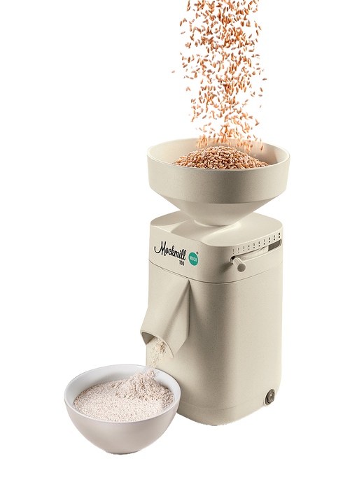 Electric stone grain mill in a smooth beige finish with large open hopper pouring wheat into the mill and fresh flour flowing into a white bowl, featured in Kitchen & Food, Grain Mills, Best Sellers, Promo Eligible, and New collections.