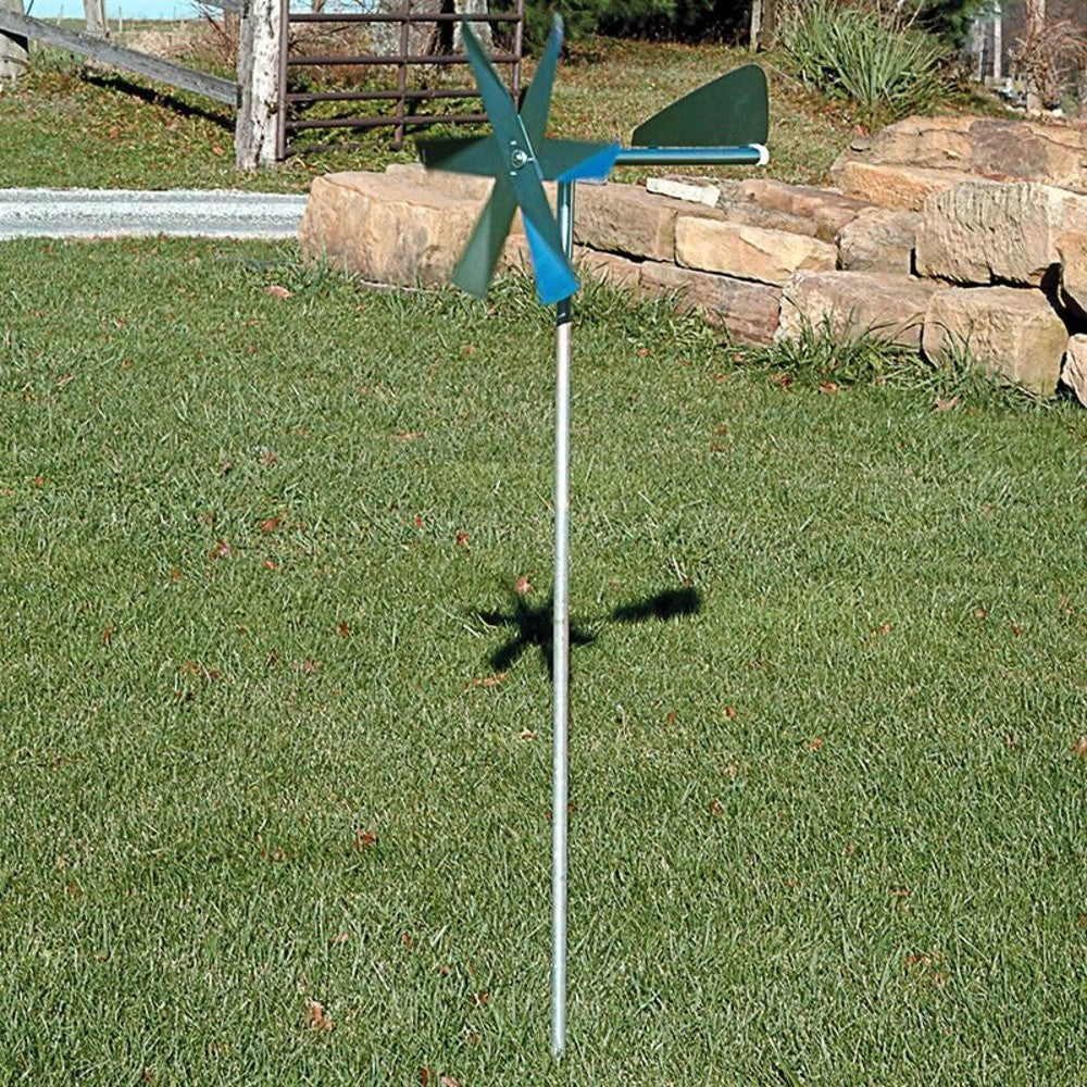 Handcrafted windmill mole deterrent with metal blades and tail vane mounted on a slender galvanized steel post, designed for humane pest control in Farm, Garden & Tool, Lawncare, Pest Control, Best Sellers, and Promo Eligible collections.
