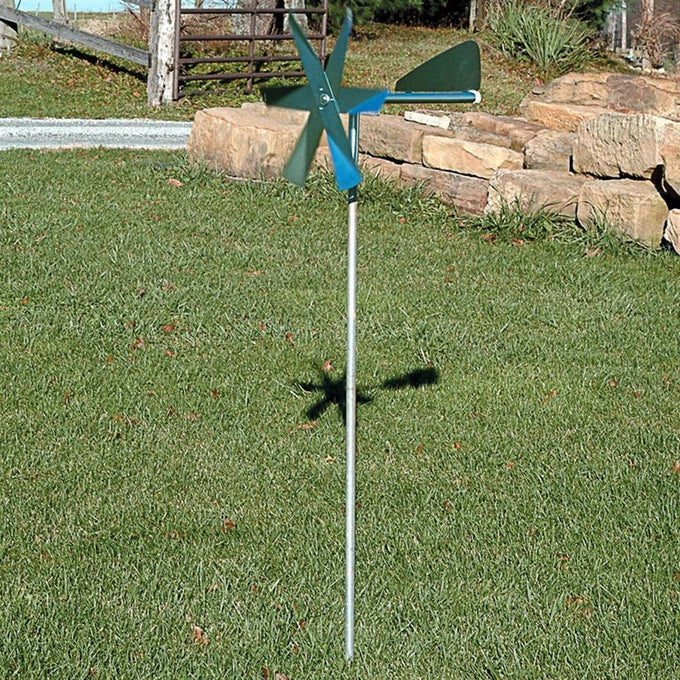 Handcrafted windmill mole deterrent with metal blades and tail vane mounted on a slender galvanized steel post, designed for humane pest control in Farm, Garden & Tool, Lawncare, Pest Control, Best Sellers, and Promo Eligible collections.