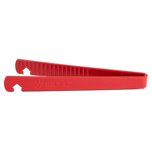 Side view of a red Butterie toaster tong featuring serrated teeth and an integrated oven rack hook, part of Kitchen & Food and Kitchen Gadgets collections.