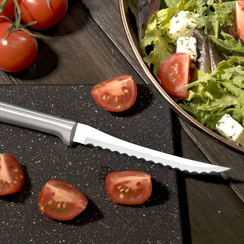 Handcrafted Rada Tomato Slicer with hand-sharpened high carbon surgical stainless steel serrated blade and solid aluminum handle, slicing ripe tomatoes on a cutting board, USA Made, ideal for kitchen food prep and Farm, Garden & Tool collections.
