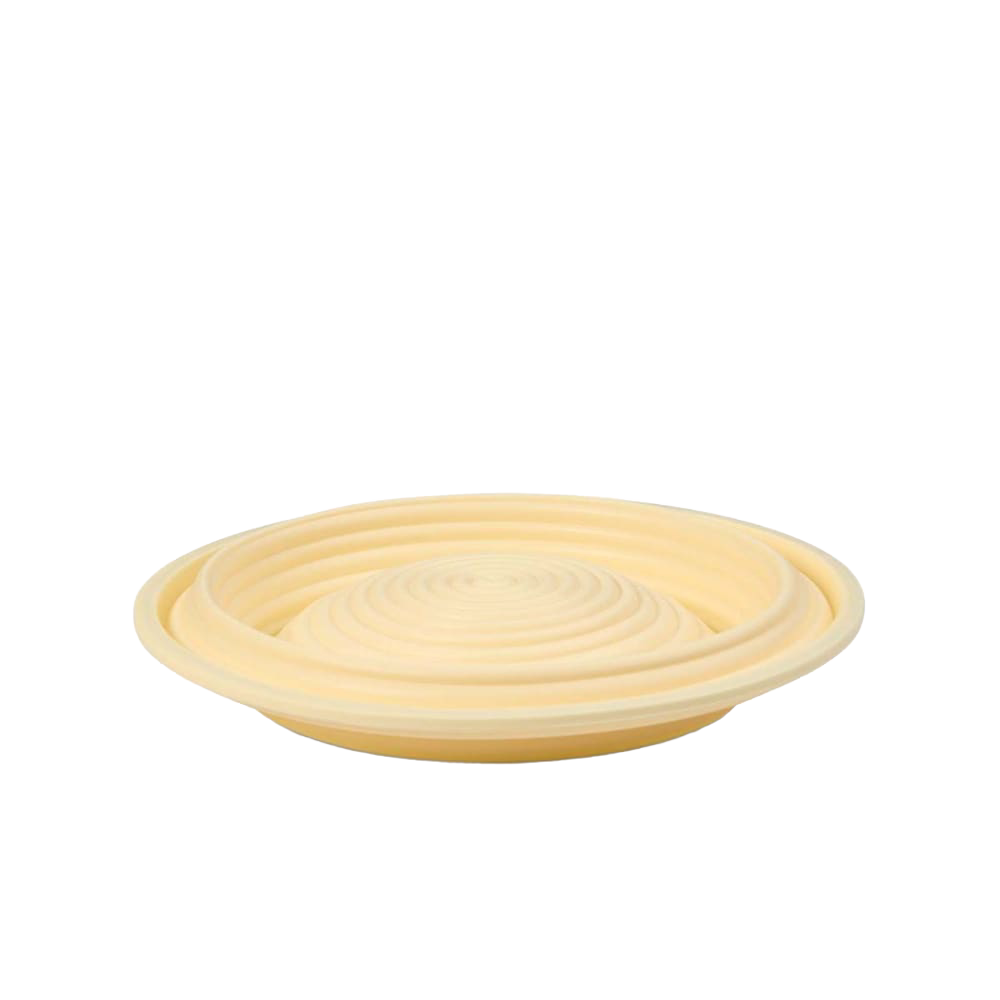 Light beige collapsible bread proofing basket with concentric grooves, crafted from silicone with steel rim for easy dough shaping and compact storage, ideal for Kitchen & Food and Baking Supplies collections.