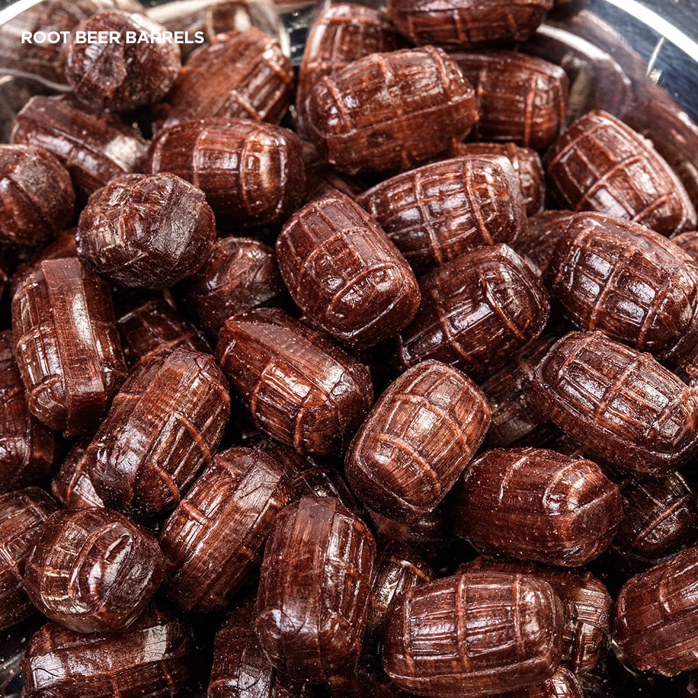 Close-up of glossy root beer barrel-shaped hard candies with detailed ridges, evoking classic American sweets from Kitchen & Food, Snacks and Sweets, Best Sellers, and Promo Eligible collections.