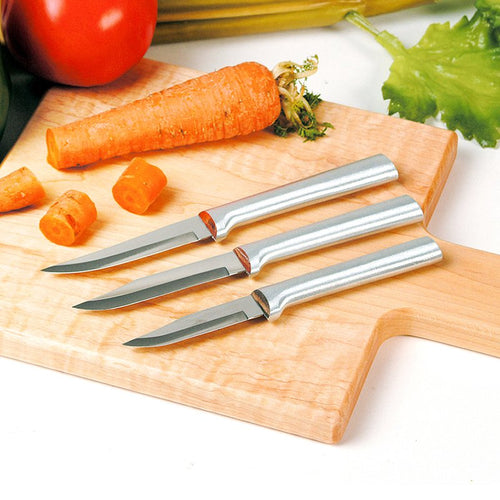 Three sharp carbon stainless steel paring knives with satin-finished cast aluminum handles displayed on a wooden cutting board with a carrot, tomato, and lettuce, ideal for Kitchen & Food and USA Made collections.