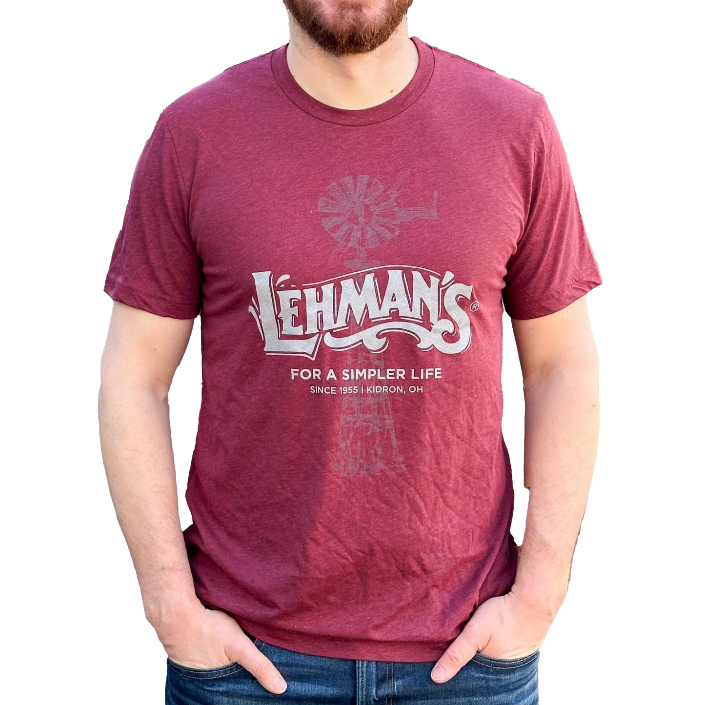 Man wearing a soft, lightweight maroon tee featuring a subtle windmill graphic and "Lehman's For a Simpler Life" print, suitable for Health & Wellness, Clothing and Accessories, Best Sellers, and Promo Eligible collections.
