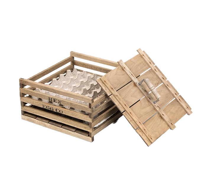 Handcrafted wooden egg crate with a slatted design and removable lid, perfect for safely transporting eggs; ideal for farm, garden, and animal care use.