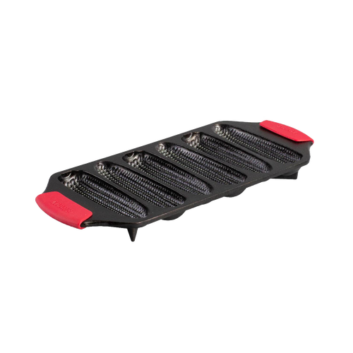 Seasoned cast iron cornstick pan with six elongated molds, dual red silicone handles, and angled feet for oven stability, handcrafted in USA, ideal for Kitchen & Food and Cast Iron cookware collections.