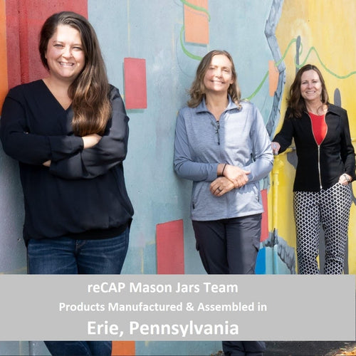 Three smiling women standing in front of a colorful mural, representing the team behind handcrafted reCAP Mason Jar FLIP Top Lids made in USA, featured in Home & Decor, Kitchen Gadgets, and Household Helpers collections.