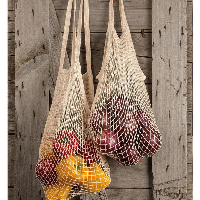 Two natural cotton reusable string bags with shoulder handles, filled with fresh fruits, ideal for Kitchen & Food, Storage and Serving, Best Sellers, and Promo Eligible collections.
