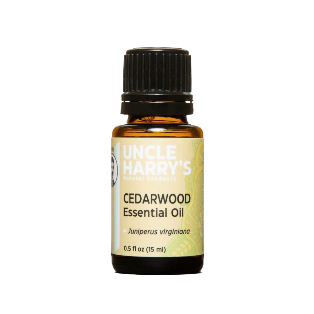 Amber glass bottle of handcrafted cedarwood essential oil with black cap and dropper, made in USA and ideal for Health & Wellness, Soapmaking, Candlemaking, and Health Remedies collections.
