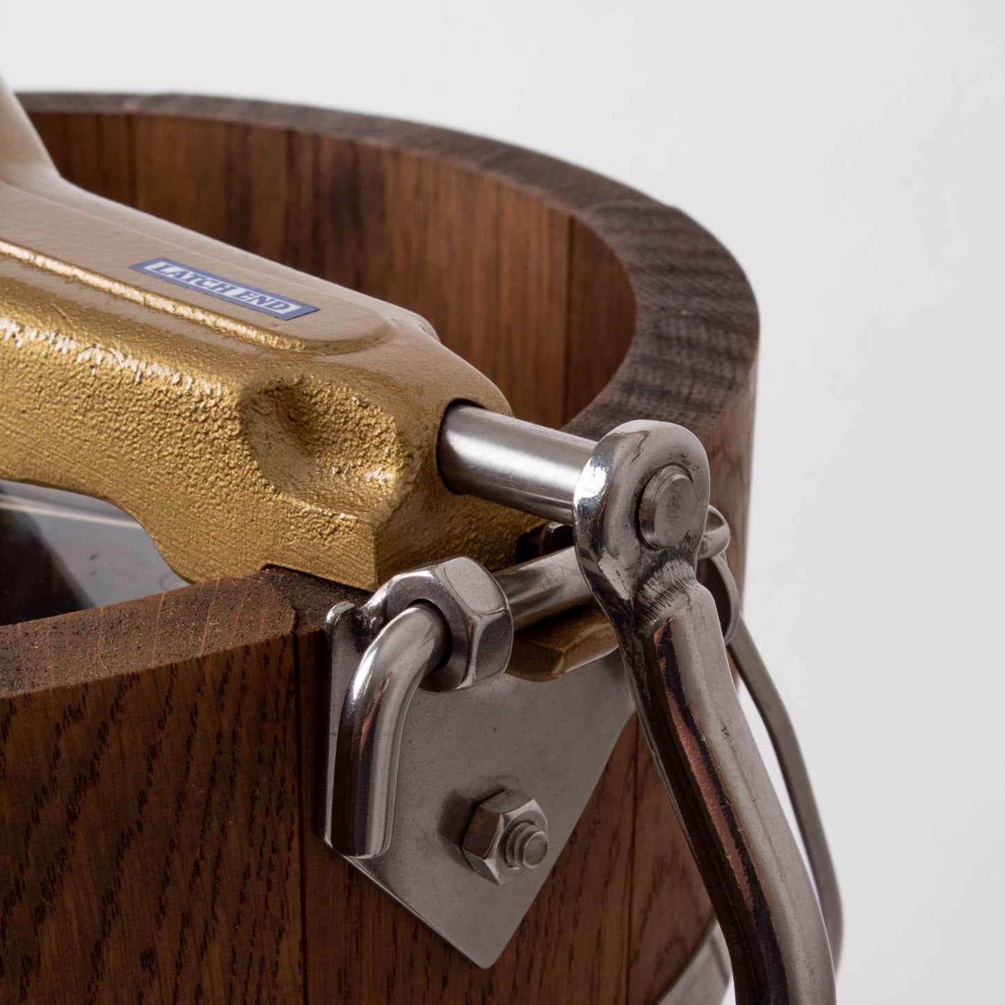 Close-up of the sturdy hand crank mechanism on a handcrafted wooden ice cream freezer, featuring rugged metal hardware and rich wood grain, ideal for Kitchen & Food and Specialty Equipment collections.