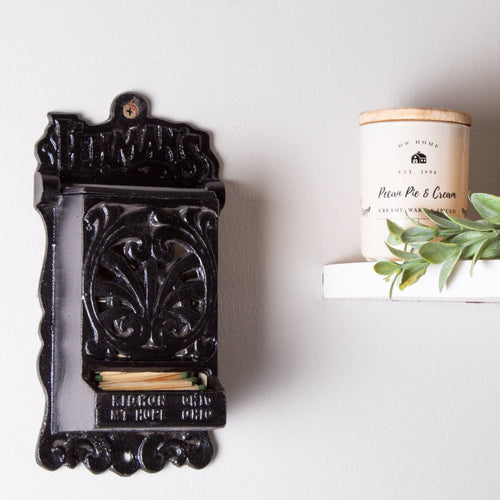 Handcrafted black cast iron wall-mounted matchbox holder with vintage ornamental design, Amish made in USA, ideal for Home & Decor, Household Helpers, Lamps & Lighting, and Best Sellers collections.
