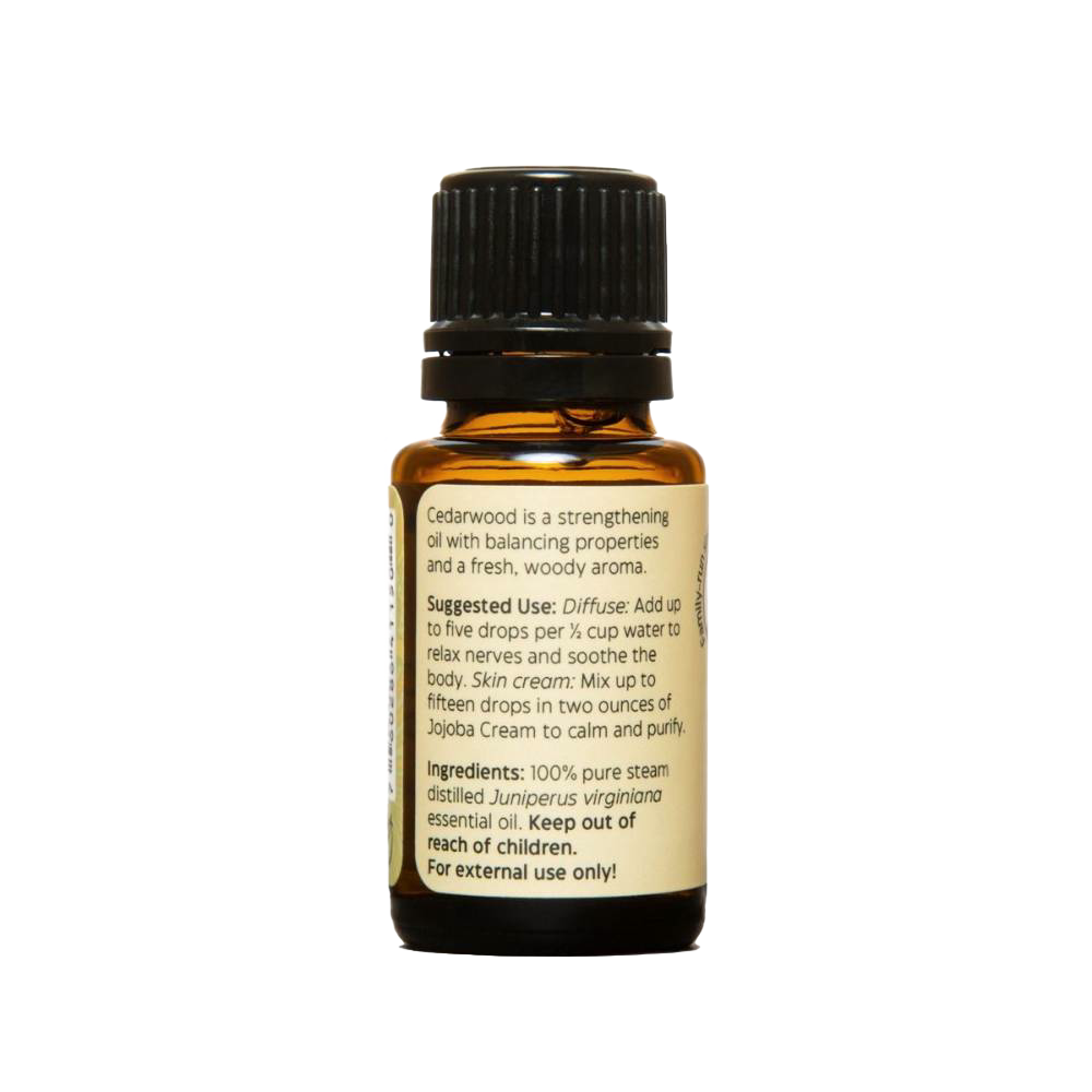 Amber glass bottle of pure essential oil with black cap and label detailing suggested uses and ingredients, ideal for health remedies, aromatherapy, and soapmaking.
