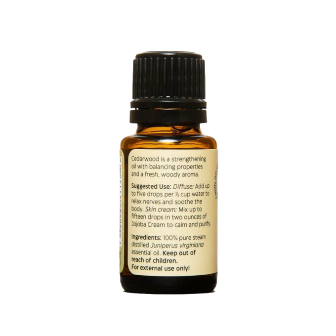 Amber glass bottle of pure essential oil with black cap and label detailing suggested uses and ingredients, ideal for health remedies, aromatherapy, and soapmaking.