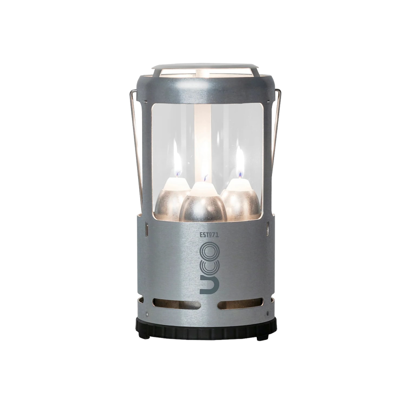 Handcrafted durable candle lantern with three burning candles protected by glass and metal frame, perfect for camping, farm, garden, emergency supplies, and outdoor lighting needs.