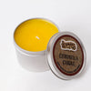 Hand-poured Amish-made bright yellow citronella candle in a lightweight metal tin with branded lid, perfect for outdoor use in camping, pest control, and garden lighting collections.